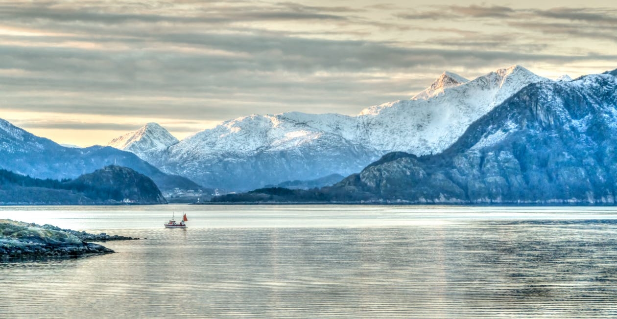 https://www.pexels.com/photo/adventure-boat-cloudy-sky-coastline-358384/