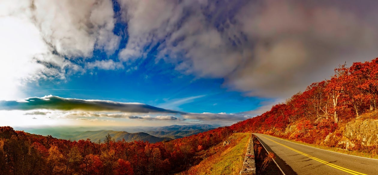 https://www.pexels.com/photo/scenic-view-of-mountain-road-against-cloudy-sky-247528/