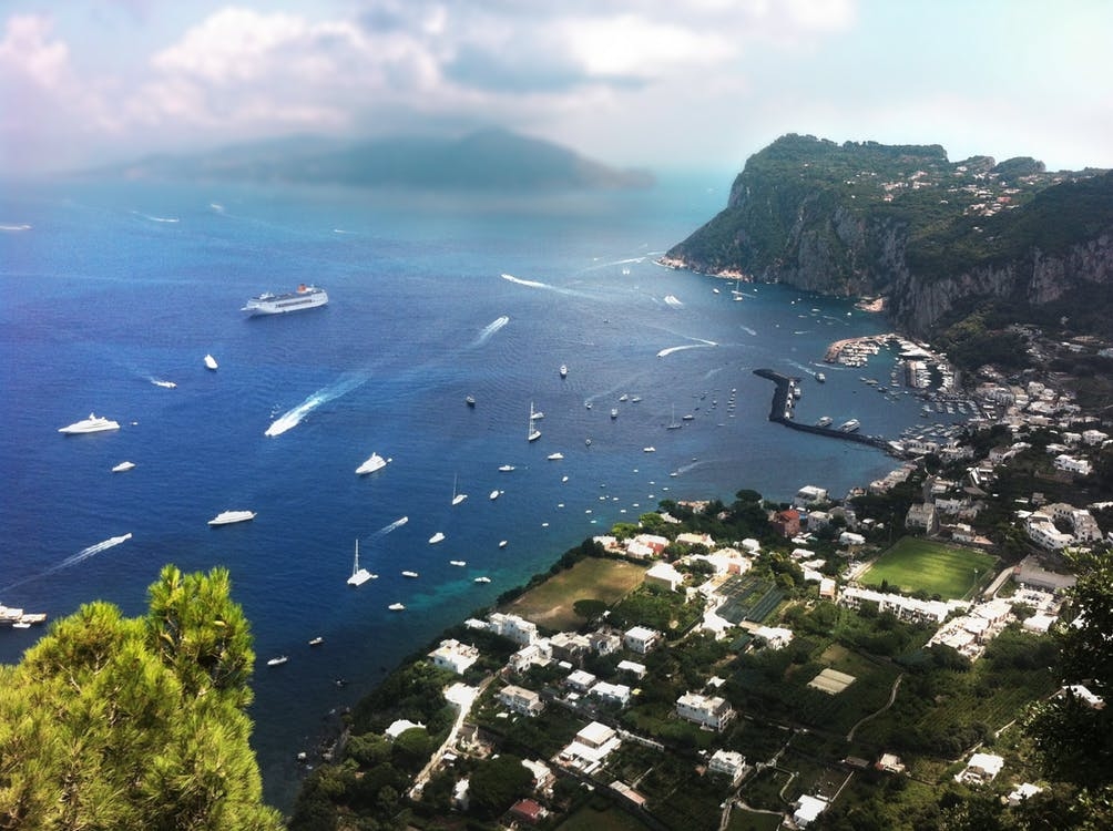 https://www.pexels.com/photo/white-yacht-on-body-of-water-near-green-island-during-daytime-15804/