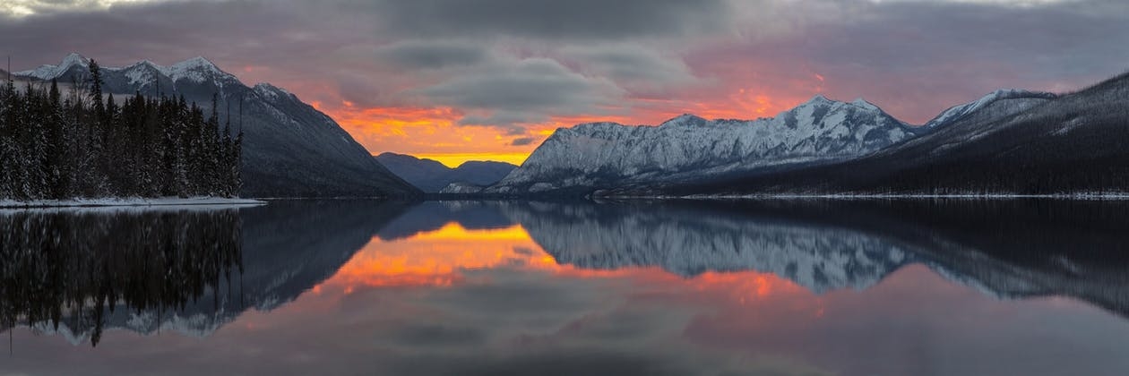 https://www.pexels.com/photo/reflection-of-mountains-in-lake-during-sunset-326243/