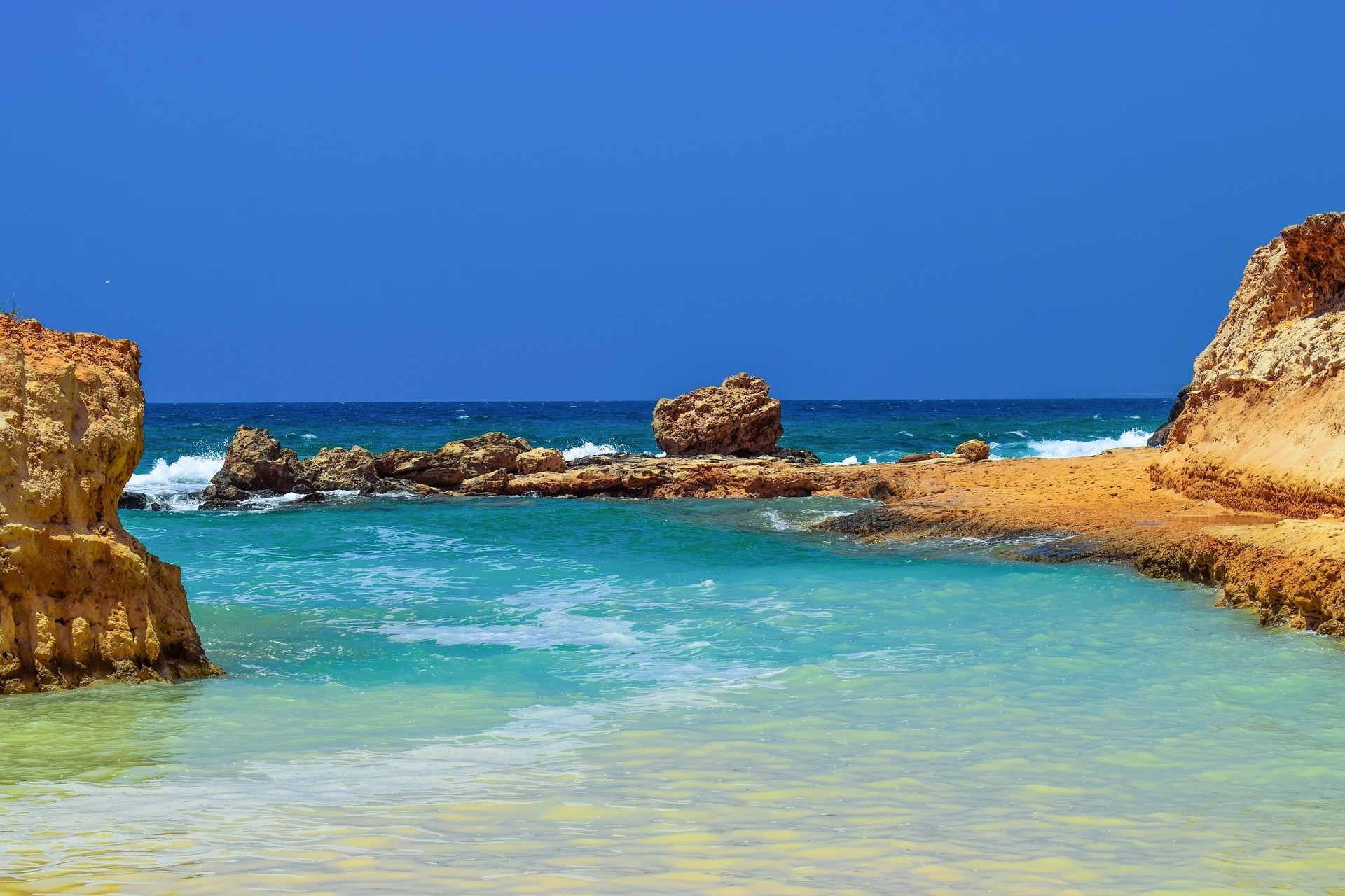 https://pixabay.com/en/cove-lagoon-rocky-coast-blue-2424638/